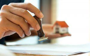 stamping a seal on pre-approval letters for mortgage