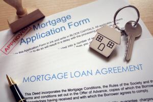 mortgage application form, loan agreement and house key